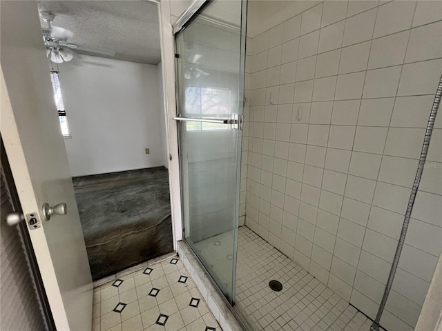 182 114th Ter NE Unit 182, Saint Petersburg, FL 33716 - full bath featuring a textured ceiling, ceiling fan, and a shower stall
