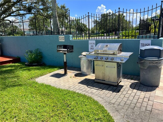 view of patio featuring grilling area and fence