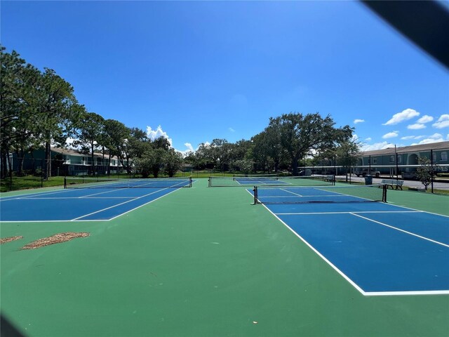 view of sport court with community basketball court and fence