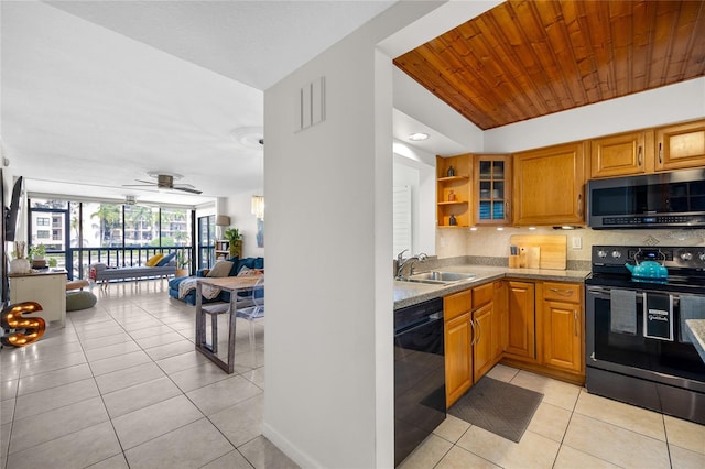 kitchen with black dishwasher, sink, tasteful backsplash, ceiling fan, and range with electric cooktop