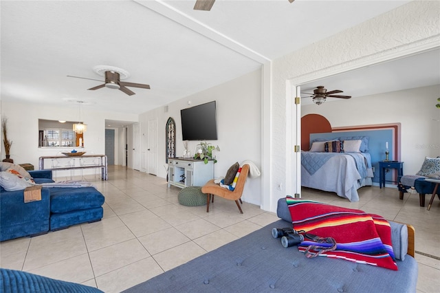 tiled bedroom with ceiling fan