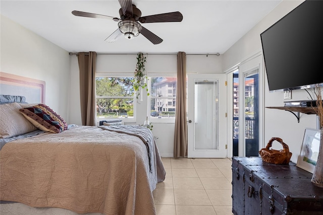 bedroom featuring ceiling fan, access to exterior, and light tile patterned floors