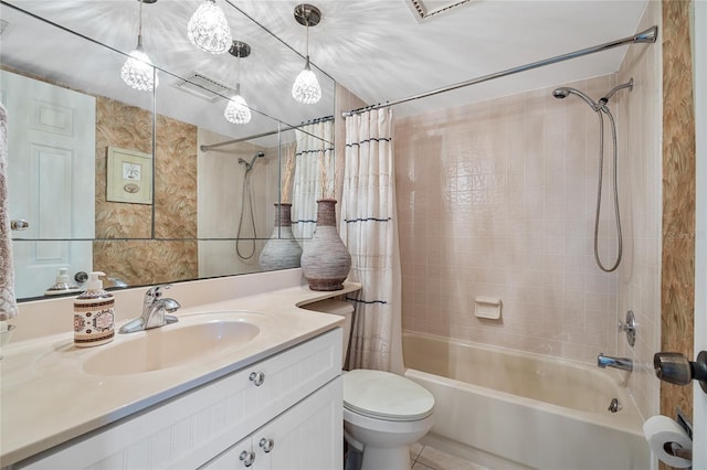 full bathroom featuring tile patterned floors, toilet, vanity, and shower / tub combo