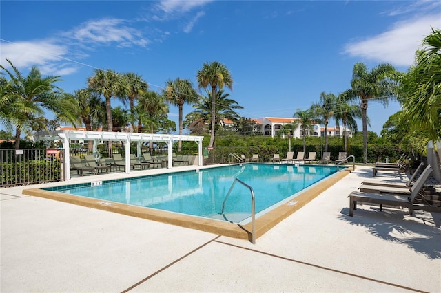 view of pool with a patio and a pergola