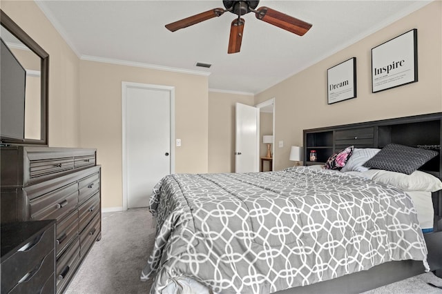 carpeted bedroom featuring visible vents, a ceiling fan, and ornamental molding