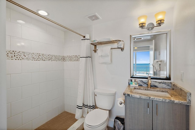 bathroom featuring a shower with shower curtain, toilet, and vanity