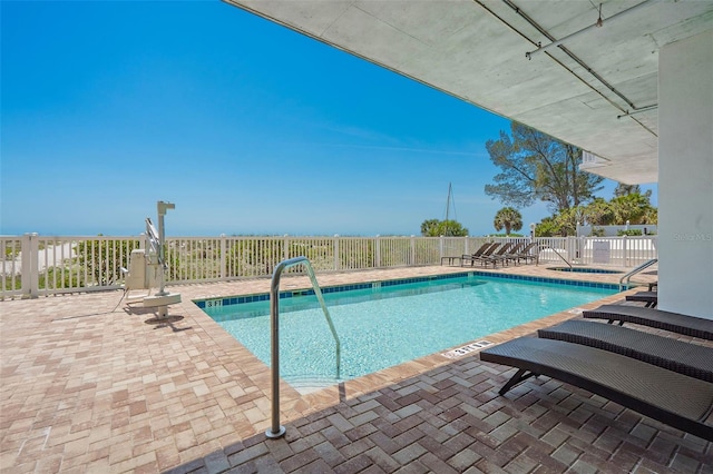 view of swimming pool with a patio area