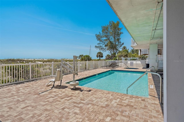 view of pool featuring a patio