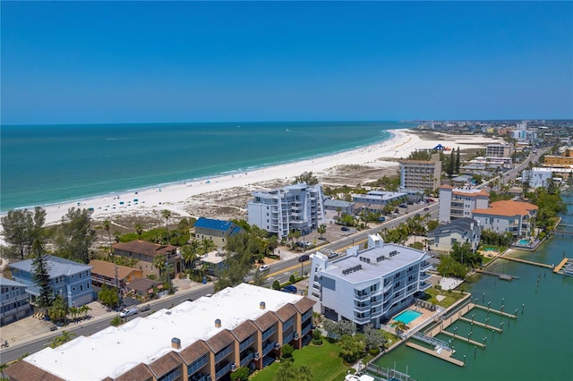 birds eye view of property with a beach view and a water view