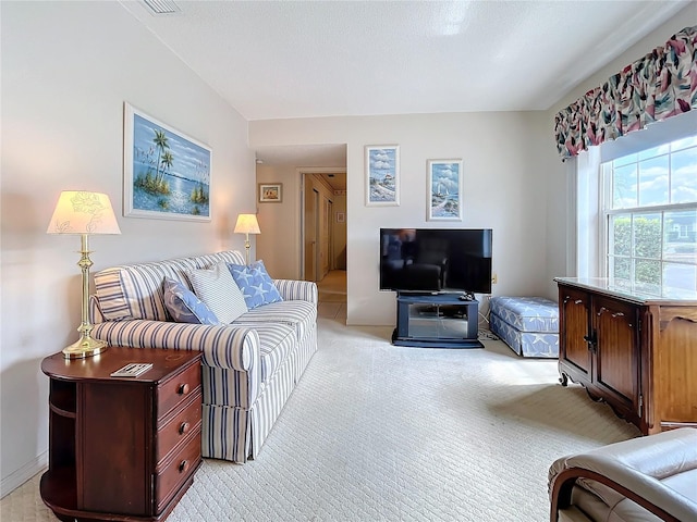 living area featuring light colored carpet