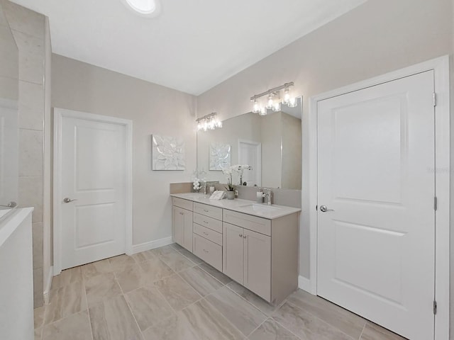 bathroom featuring tile patterned flooring and vanity