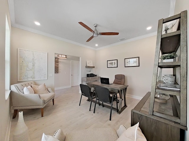 dining space with light hardwood / wood-style floors, crown molding, and ceiling fan