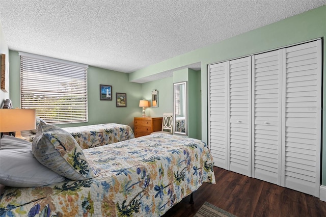 bedroom featuring wood-type flooring and a textured ceiling