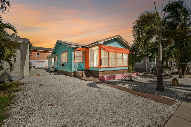 3108 58th St S, Gulfport, FL 33707 - view of front of property featuring gravel driveway and crawl space
