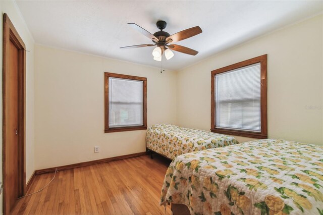 bedroom featuring light wood-type flooring and ceiling fan