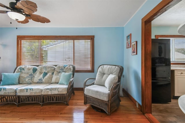3108 58th St S, Gulfport, FL 33707 - sitting room with light wood-style flooring, baseboards, and a ceiling fan