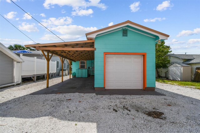 3108 58th St S, Gulfport, FL 33707 - exterior space featuring an outbuilding, fence, a shed, and gravel driveway
