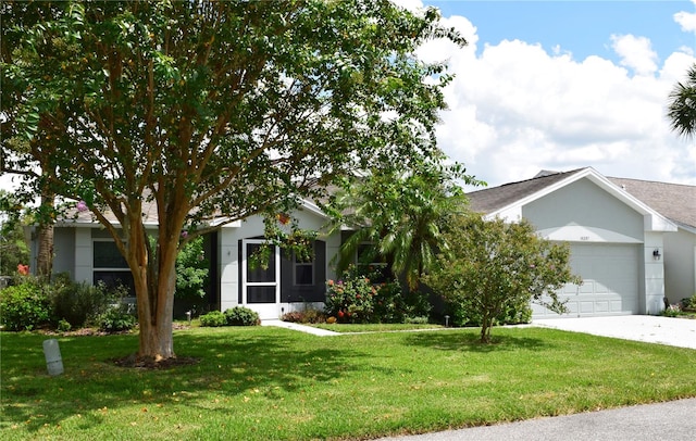 view of front of home featuring a front yard and a garage