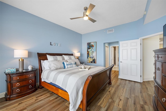 bedroom with ceiling fan and wood-type flooring