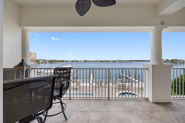 balcony featuring a water view