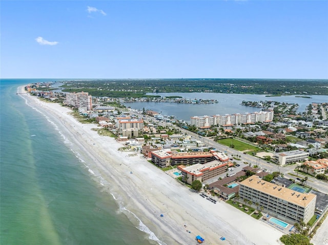 drone / aerial view with a beach view and a water view