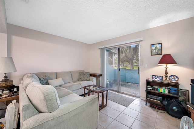 tiled living room with a textured ceiling