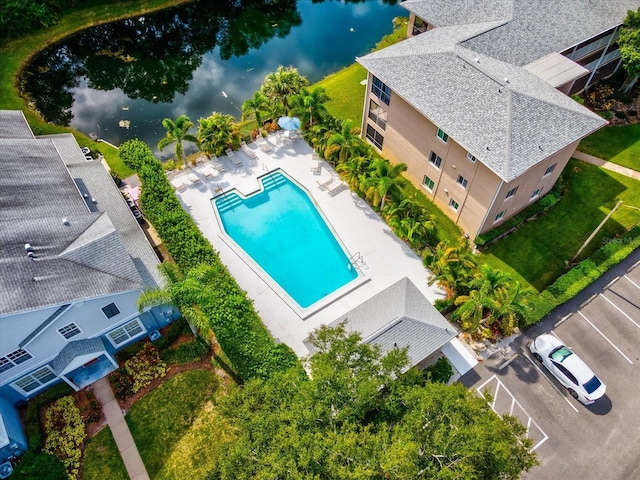 birds eye view of property featuring a water view