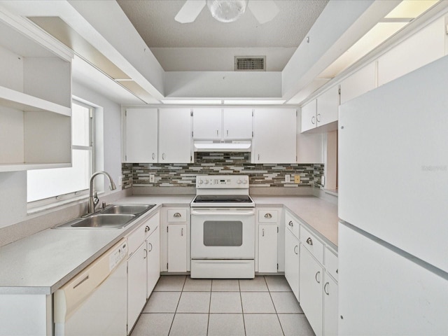 kitchen featuring ceiling fan, sink, white appliances, and white cabinets