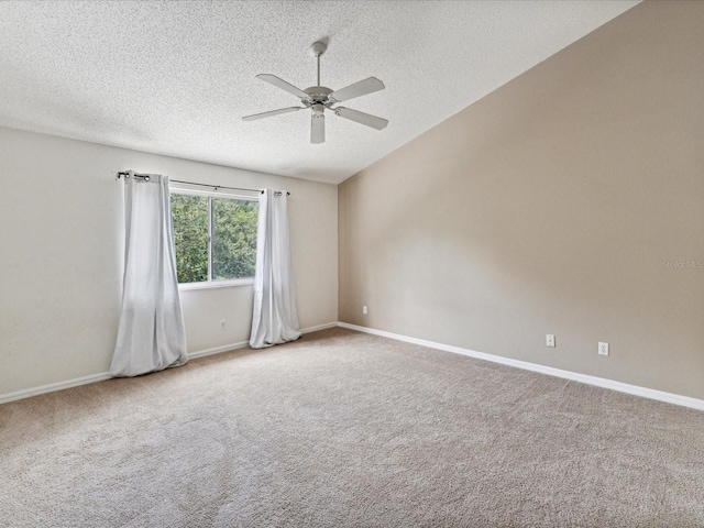 unfurnished room featuring light colored carpet, a textured ceiling, and ceiling fan