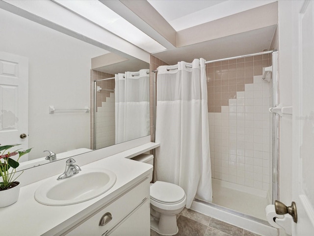 bathroom with tile patterned flooring, toilet, vanity, and curtained shower