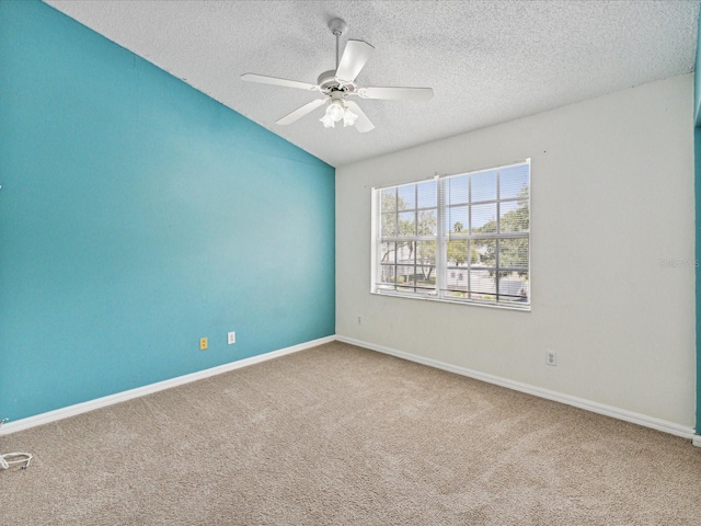 spare room with ceiling fan, carpet, and a textured ceiling