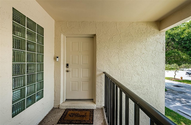 entrance to property featuring a balcony