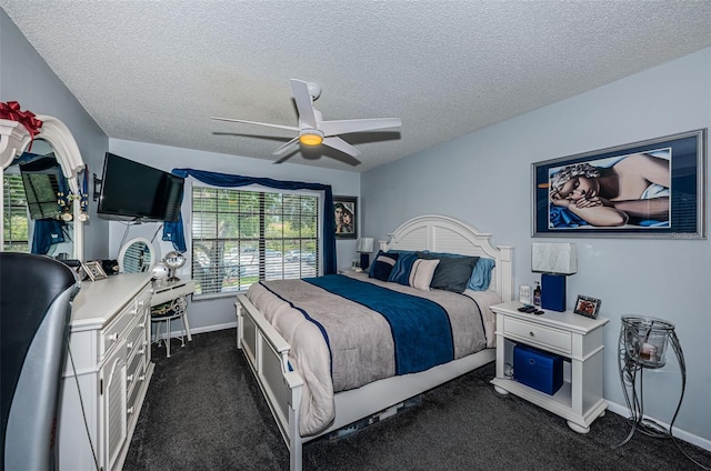 bedroom featuring ceiling fan, a textured ceiling, and dark colored carpet