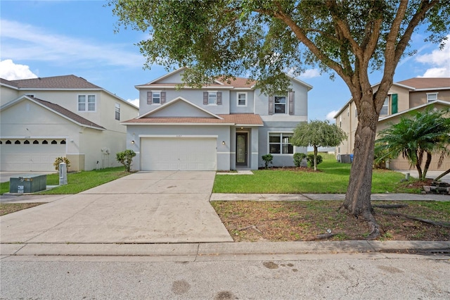 view of front of property featuring a garage and a front yard