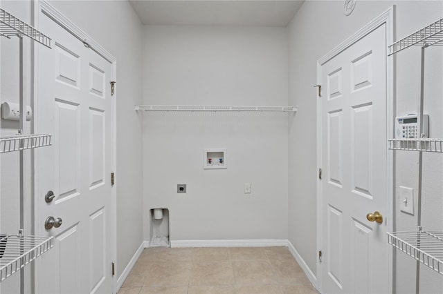 laundry room with hookup for a washing machine, light tile patterned floors, and electric dryer hookup