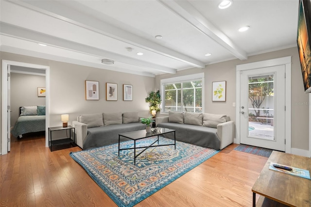 living room with light wood-type flooring and beamed ceiling