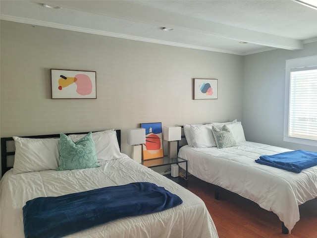 bedroom featuring beam ceiling and hardwood / wood-style floors