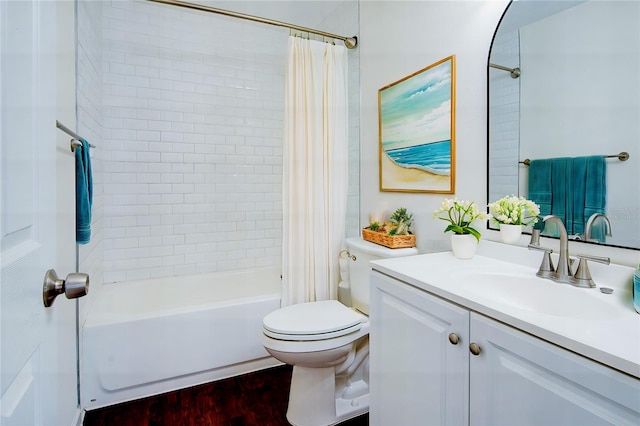 full bathroom with vanity, hardwood / wood-style flooring, toilet, and shower / bath combo with shower curtain