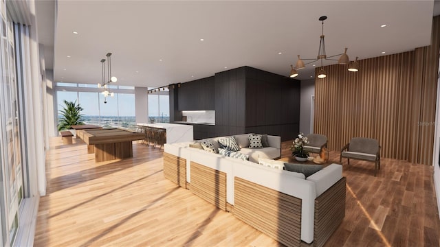 interior space with light hardwood / wood-style floors and an inviting chandelier