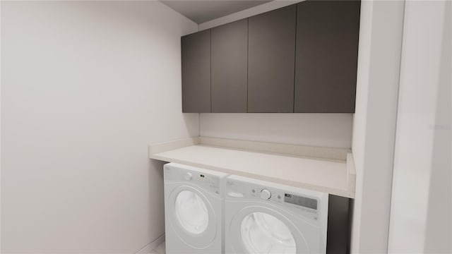 washroom featuring independent washer and dryer and cabinets