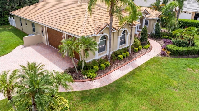 exterior space with a lawn and a garage