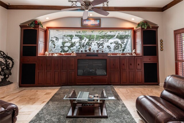 living room featuring ceiling fan and ornamental molding