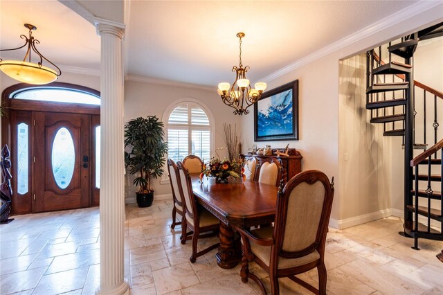 dining area with ornamental molding, a notable chandelier, and decorative columns