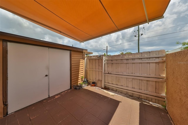 view of patio with a shed