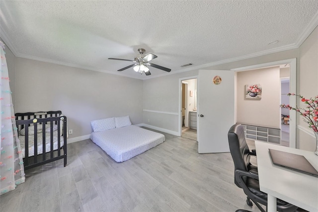 bedroom featuring light wood-type flooring, ceiling fan, and crown molding