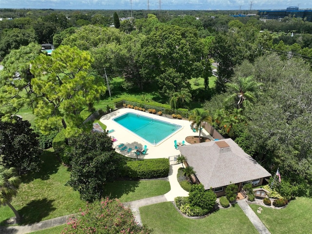 view of pool with a lawn