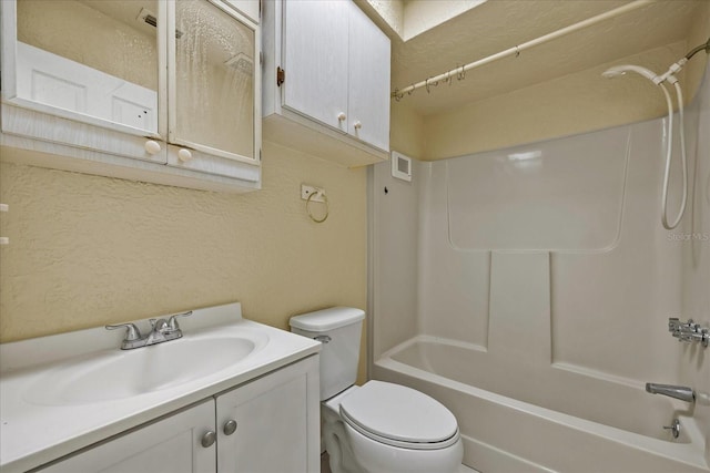 full bathroom with vanity, tub / shower combination, and toilet