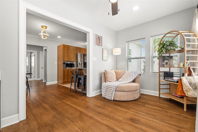 sitting room featuring hardwood / wood-style flooring and ceiling fan