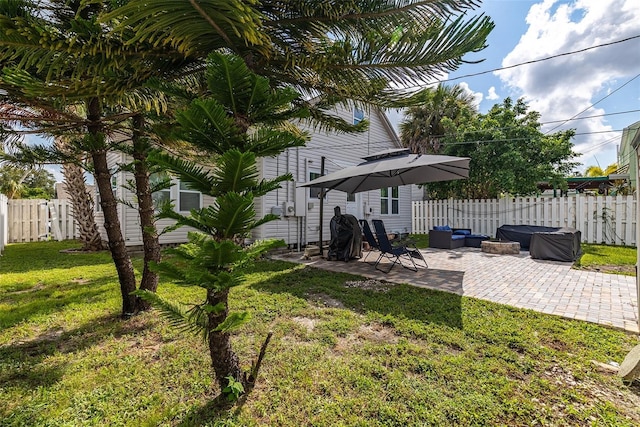 view of yard featuring a patio, an outdoor hangout area, and fence