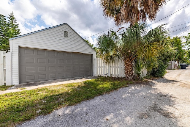 garage featuring fence